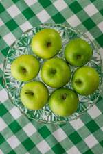 Bright Green Apples on a Crystal Cake Stand and a Gingham Tablecloth Journal